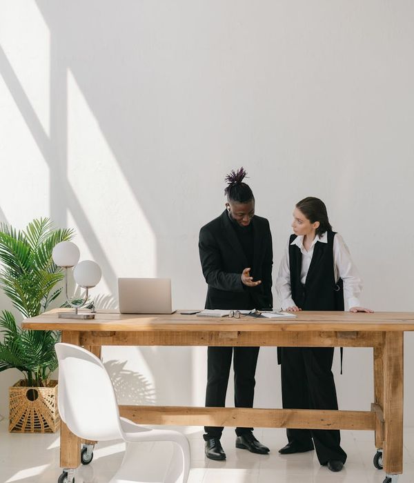 man investment consultant meeting with clients in modern office setting